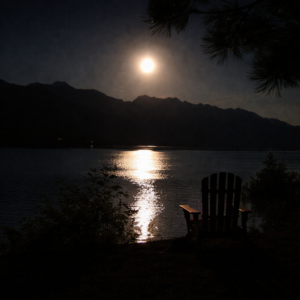 Full moon reflecting on water beside empty chair, symbolizing reflection and lunar wisdom